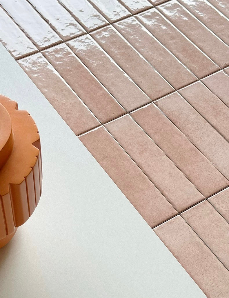 Close-up of pink tiles on a white surface